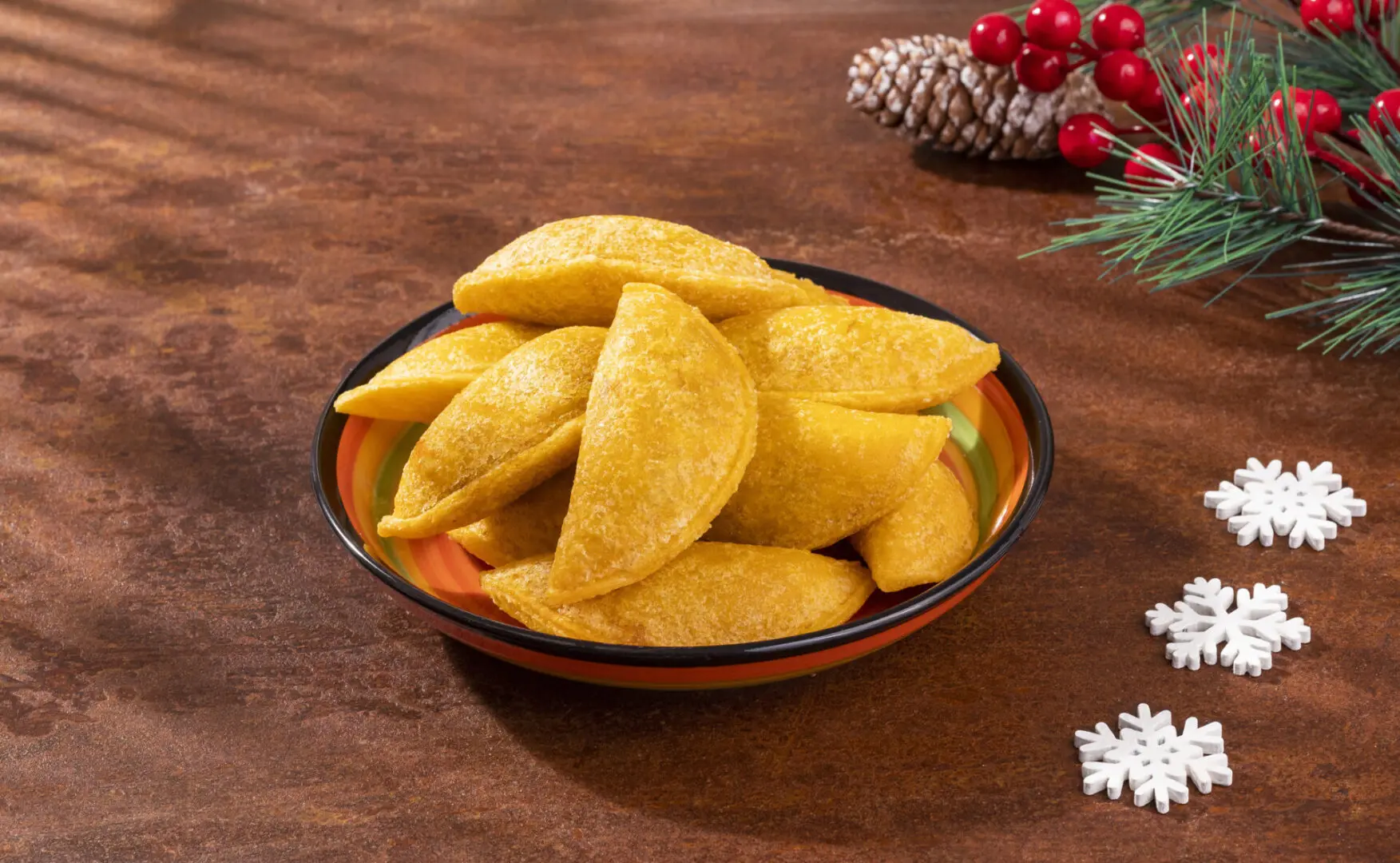 Fried pastries in a bowl on a table.