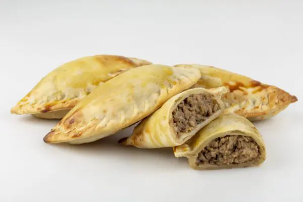 Four savory pastries with meat filling.